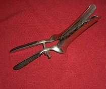 Twin bladed speculum