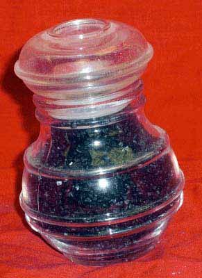 Mineral Sample In Glass Bottle